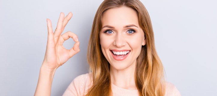 People body language facial emotion expressions people person concept. Close up portrait of excited lovely delightful cute confident manager making ok sign isolated on gray background coy-space