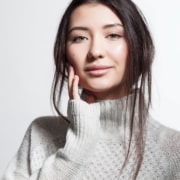 Pretty smiling woman with clean skin in white fluffy sweater