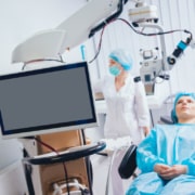 Patient in an eye surgery operating room being prepared for their PRK vision correction procedure.