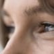 Close up of a woman's eyes looking to the side after improving her vision using bladeless LASIK.